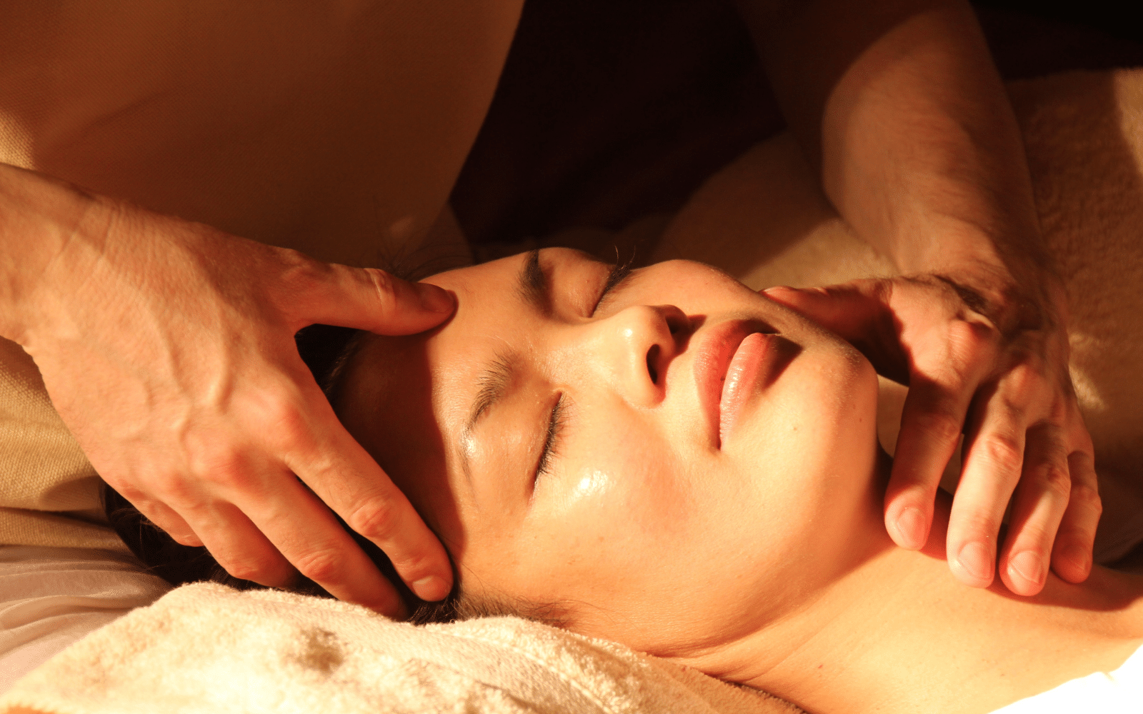 seek THE WILDNESS to nourish skin and soul woman at a spa receiving a facial